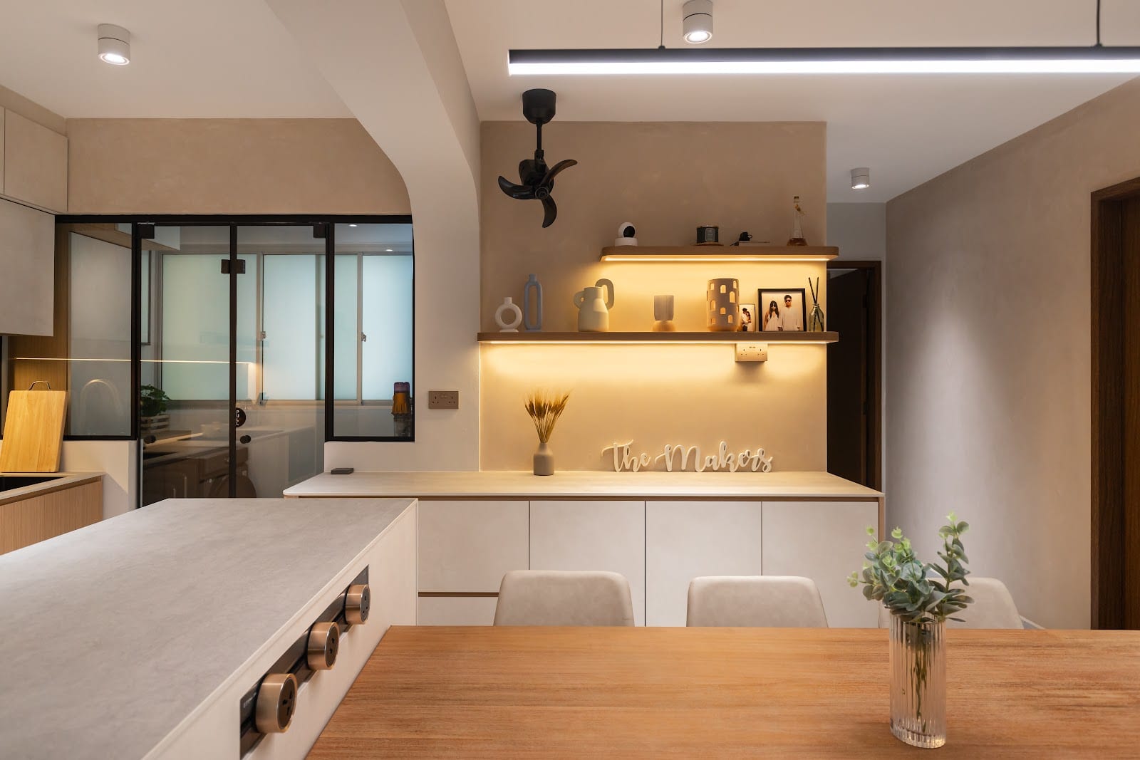 Custom carpentry and dining table integration by The Makers Design Studio